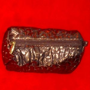 Rich bronze Lancome cosmetic pouch